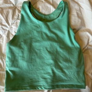 Cropped, tight, green athletic shirt